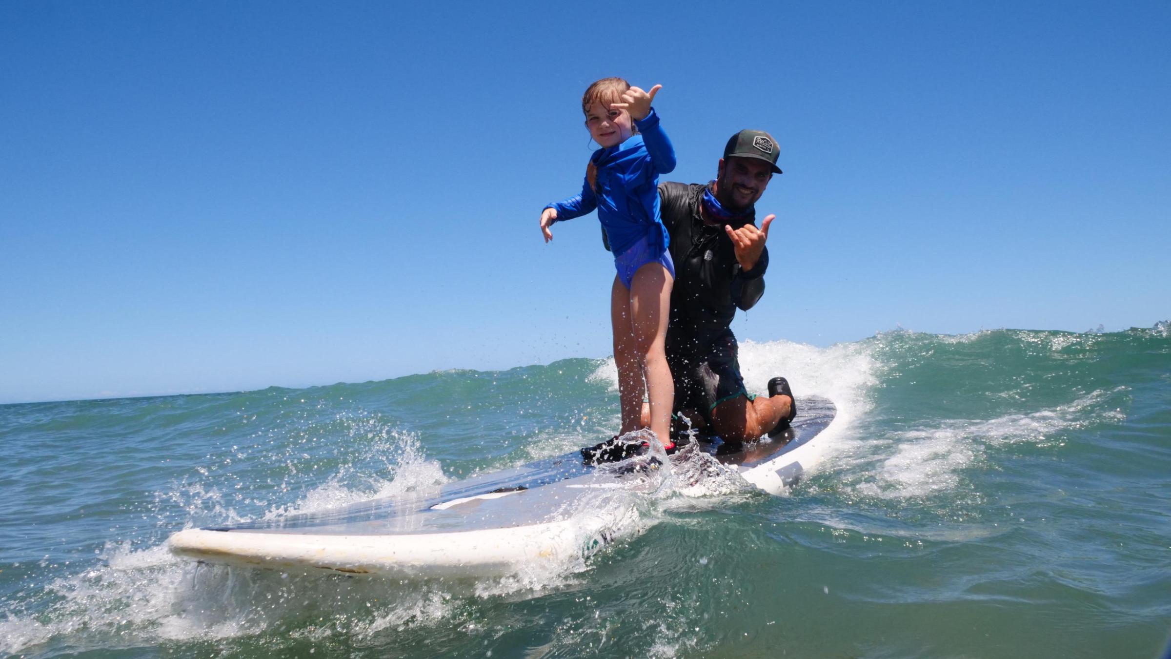 a man riding a wave on a surfboard in the ocean