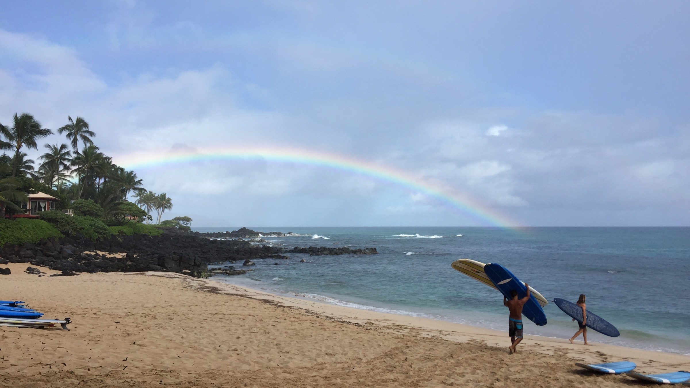 a man standing on top of a sandy beach