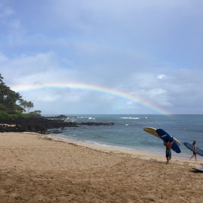 a man standing on top of a sandy beach